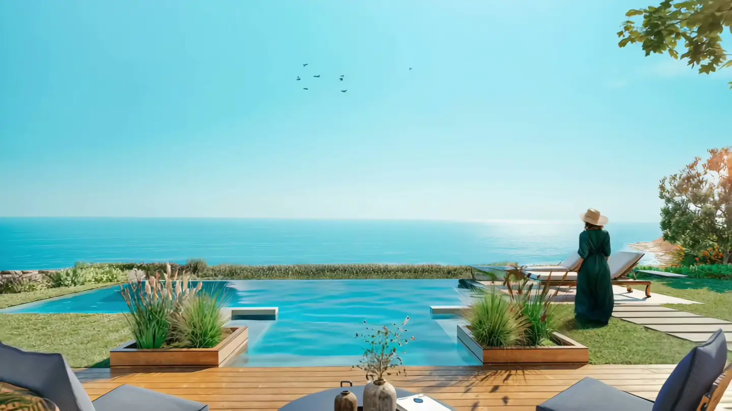 Pool and sea view from a villa garden